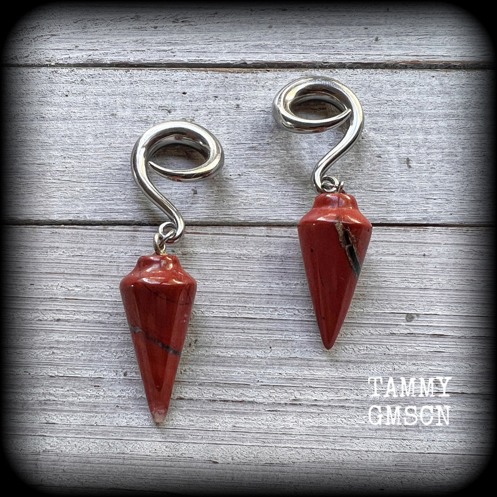 These gorgeous gauged earrings have been made with beautiful brick red jasper pendulums, measuring just over 7 cms from tip to tip, and weighing approx 14 grams each.

This pair has been made on 2 gauge (6mm) surgical steel full curl hooks, to be worn in stretched lobes.