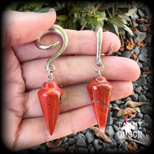 These gorgeous gauged earrings have been made with beautiful brick red jasper pendulums, measuring just over 7 cms from tip to tip, and weighing approx 14 grams each.

This pair has been made on 2 gauge (6mm) surgical steel full curl hooks, to be worn in stretched lobes.