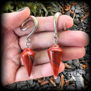 These gorgeous gauged earrings have been made with beautiful brick red jasper pendulums, measuring just over 7 cms from tip to tip, and weighing approx 14 grams each.

This pair has been made on 2 gauge (6mm) surgical steel full curl hooks, to be worn in stretched lobes.