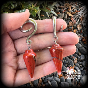 These gorgeous gauged earrings have been made with beautiful brick red jasper pendulums, measuring just over 7 cms from tip to tip, and weighing approx 14 grams each.

This pair has been made on 2 gauge (6mm) surgical steel full curl hooks, to be worn in stretched lobes.