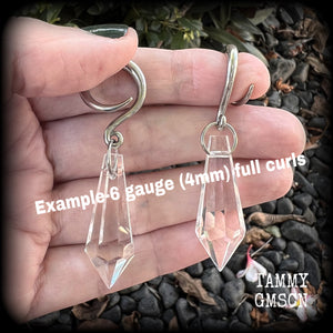 These gorgeous dangly glass earrings have been made with gorgeous faceted faux glass spears, measuring 6.5 cms from tip to tip, and weighing approx 8 grams each.

These earrings have been made on 6 gauge (4mm) surgical steel full curls, to be worn in stretched lobes.