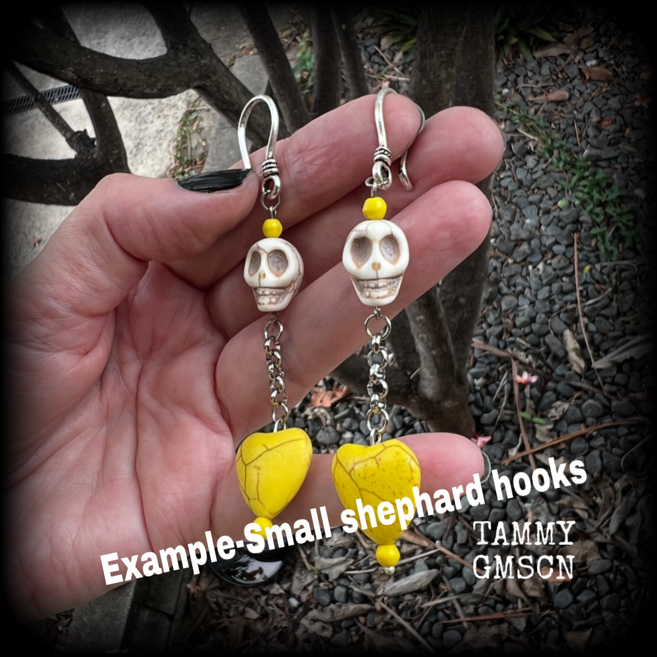 This pair of beautiful earrings features gorgeous canary yellow stone hearts dangling beneath bone white howlite stone skulls, measuring just on 9cms from tip to tip and weighing approx. 6 grams each, these are nice and dangly and not too heavy.

This pair have been made with small antique silver shephard hooks, suitable for stretched lobes when worn with silicone earlets from 8 gauge (3mm).