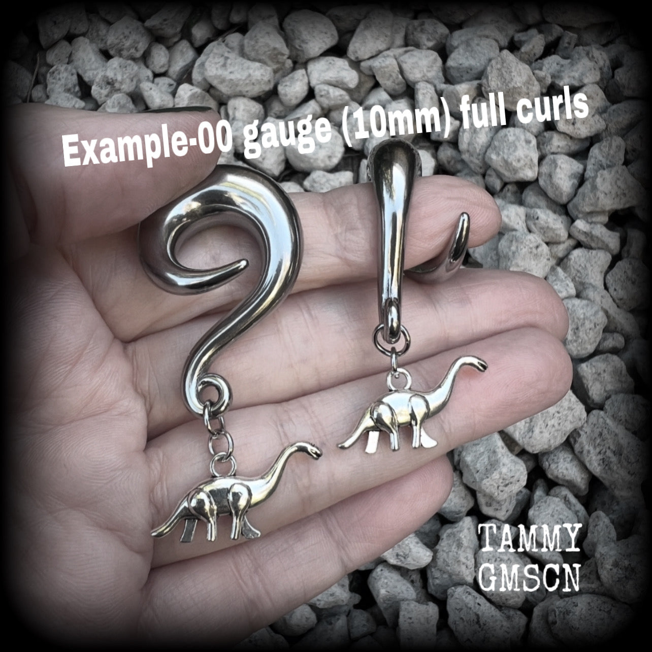 These adorable diplodocus gauged earrings are nice and light weight at 5 grams a piece, and nice and dangly at just under 5cms.

This pair has been made on 00 gauge (10mm) surgical steel full curl hooks, to be worn in stretched lobes.