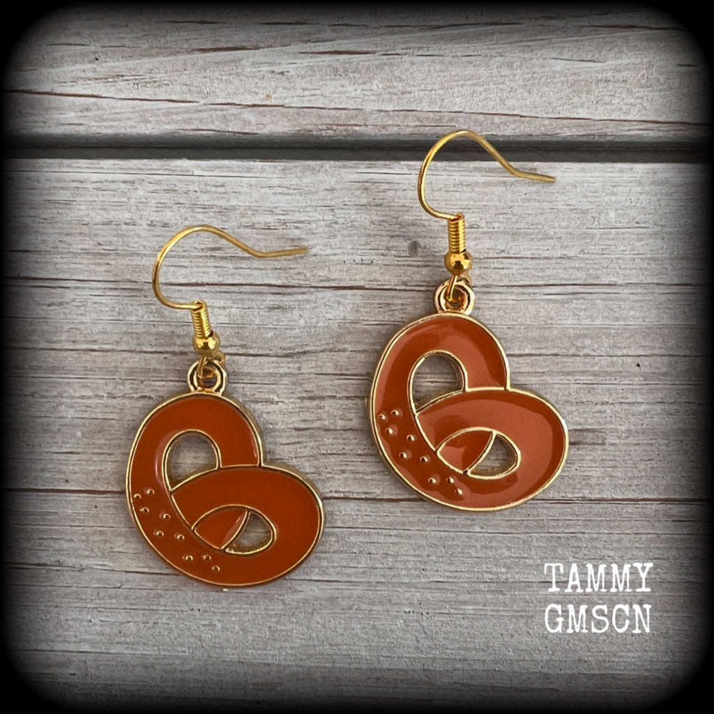 This pair of antique gold and enamel pretzel earrings measures just over 4cms from tip to tip, and are super light weight at only a few grams each.

This pair have been made with french hooks, suitable for both pierced ears.