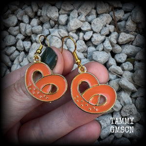 This pair of antique gold and enamel pretzel earrings measures just over 4cms from tip to tip, and are super light weight at only a few grams each.

This pair have been made with french hooks, suitable for both pierced ears.