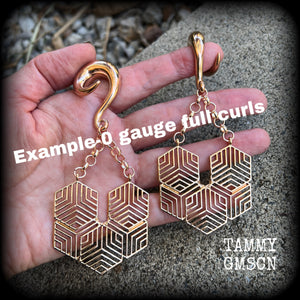 These gauged earrings feature beautiful rose gold tone geometric hexagon pendants, measuring just over 10cms from tip to tip, and weighing approx 22 grams each.
This pair has been made on 2 gauge (6mm) surgical steel full curl hooks.