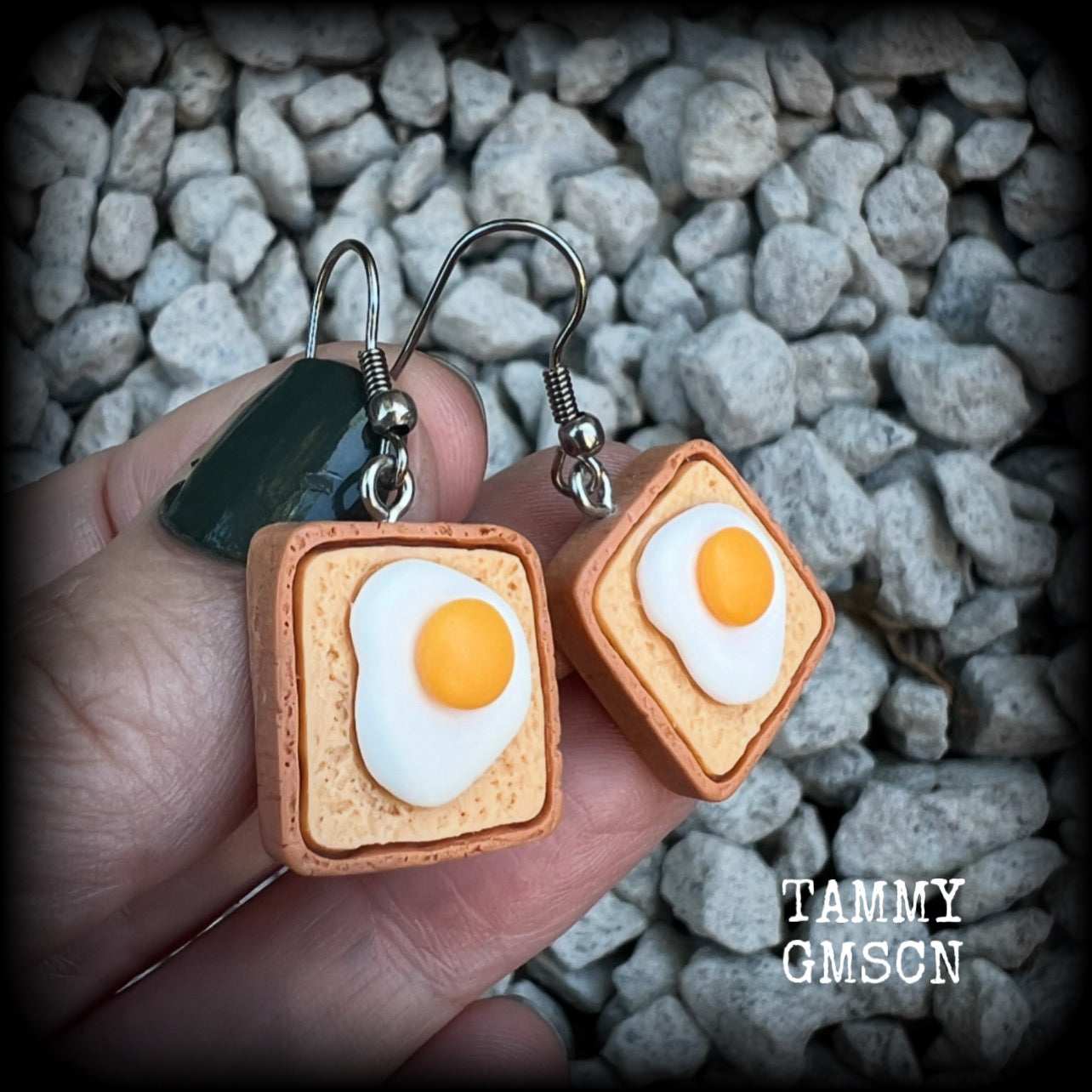 These pair of adorable earrings features eggs on bread!! Measuring just on 4cms from tip to tip, these earrings are nice and dangly and nice and light weight at only a few grams each.

This pair has been made with stainless steel french hooks for pierced ears.
