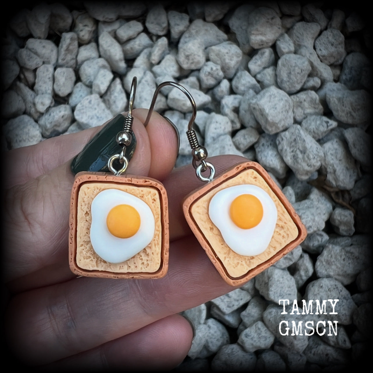 These pair of adorable earrings features eggs on bread!! Measuring just on 4cms from tip to tip, these earrings are nice and dangly and nice and light weight at only a few grams each.

This pair has been made with stainless steel french hooks for pierced ears.
