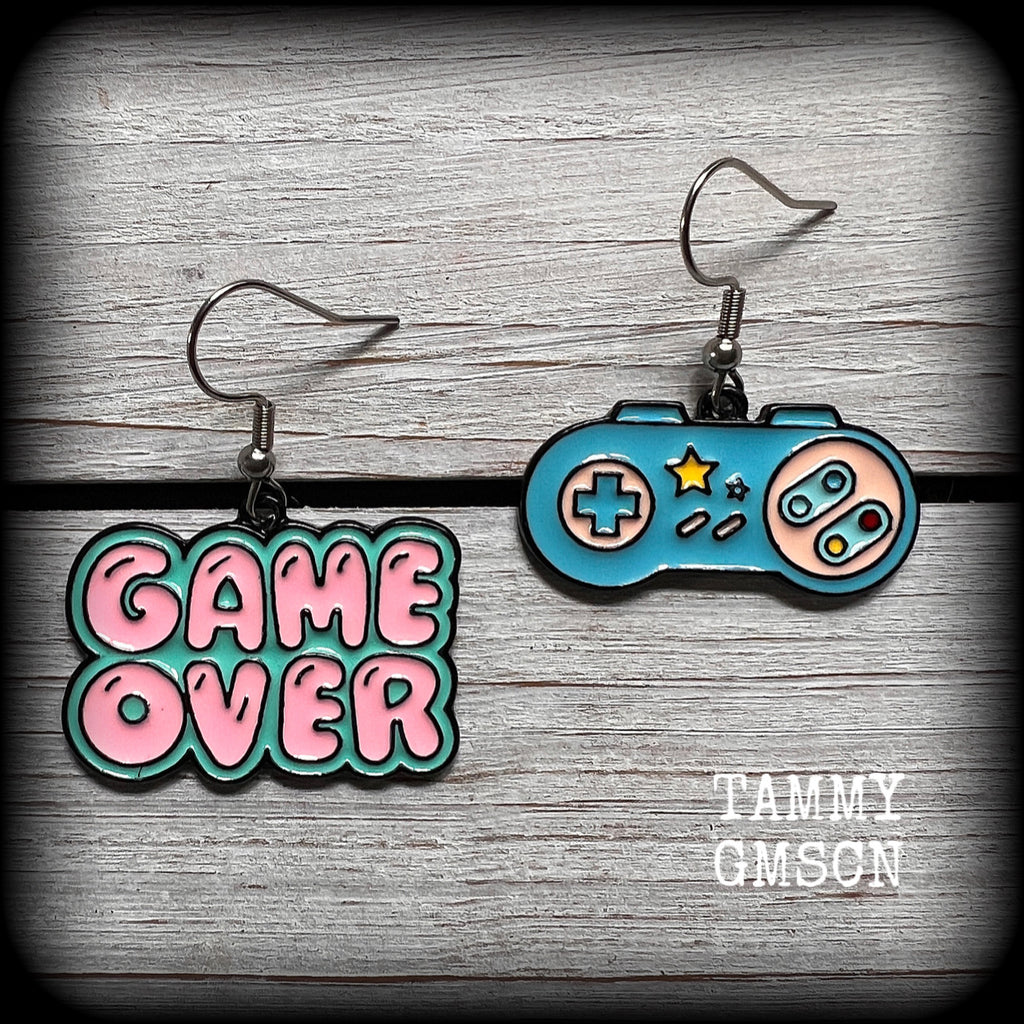 This pair of super cute ‘Game over’ gamer girl earrings measure approx 4cms from tip to tip, and weigh only a few grams each, lovely and lightweight and not too dangly.
This pair has been made with stainless steel french hooks, for pierced ears.