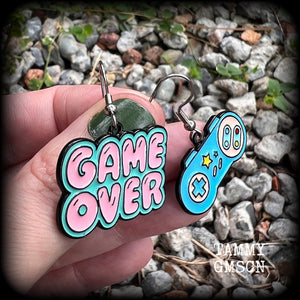 This pair of super cute ‘Game over’ gamer girl earrings measure approx 4cms from tip to tip, and weigh only a few grams each, lovely and lightweight and not too dangly.
This pair has been made with stainless steel french hooks, for pierced ears.