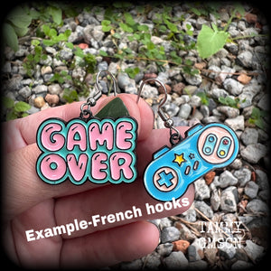 This pair of super cute ‘Game over’ gamer girl earrings measure approx 4cms from tip to tip, and weigh only a few grams each, lovely and lightweight and not too dangly.
This pair has been made with stainless steel french hooks, for pierced ears.