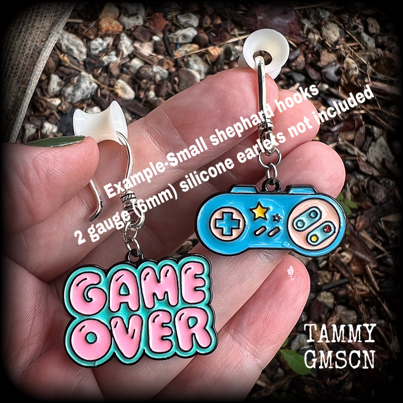 This pair of cute ‘Game over’ gamer girl earrings measure approx 4cms from tip to tip, and weigh only a few grams each, lovely and lightweight and not too dangly.
This pair has been made with antique silver small shephard hooks, for stretched lobes. 