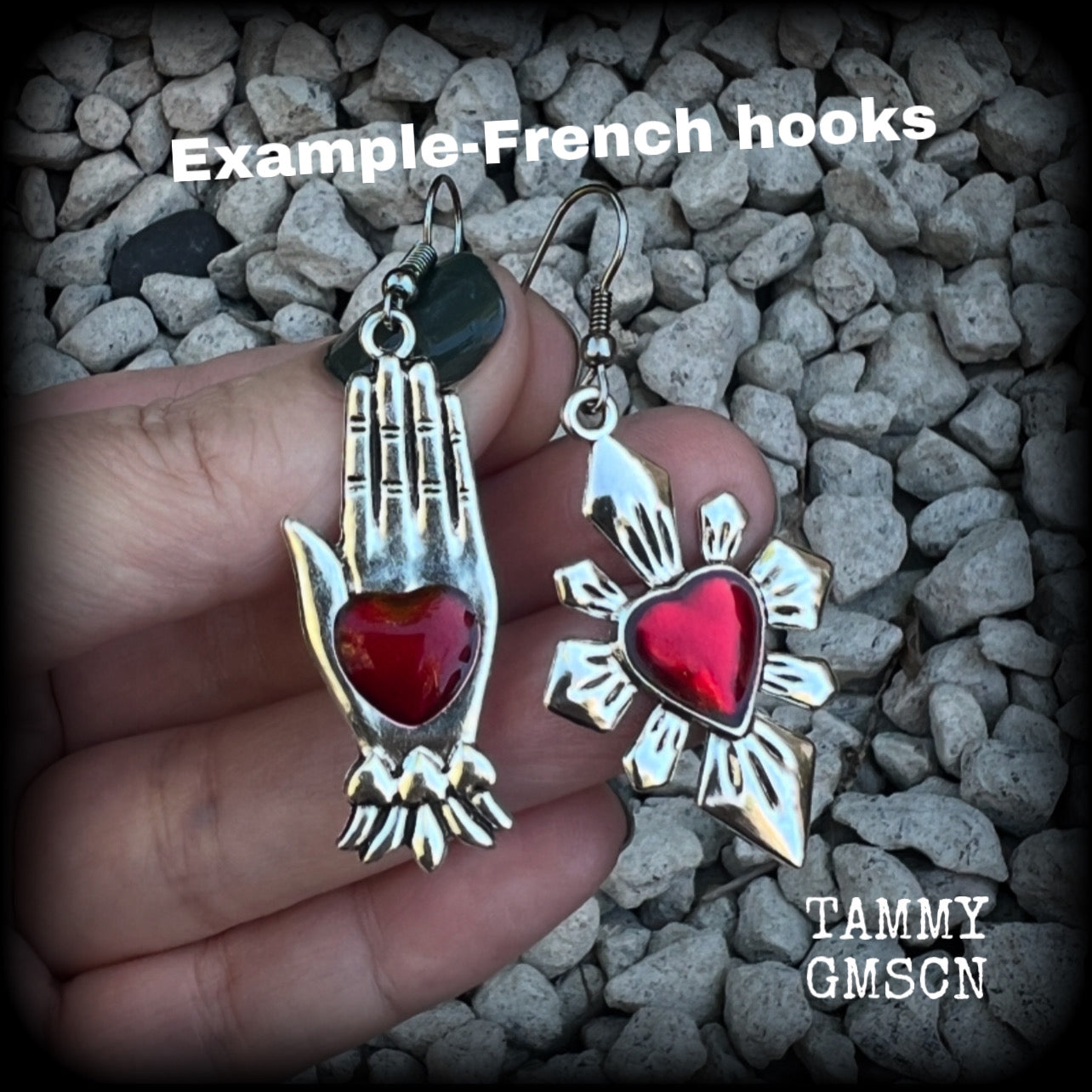 These beautiful red enamel and antique silver earrings feature a sacred heart with a sacred hand, are nice and lightweight at approx 5 grams a piece, measuring just on 6cms from tip to tip.

This pair has been made on stainless steel french hooks to be worn through pierced ears.