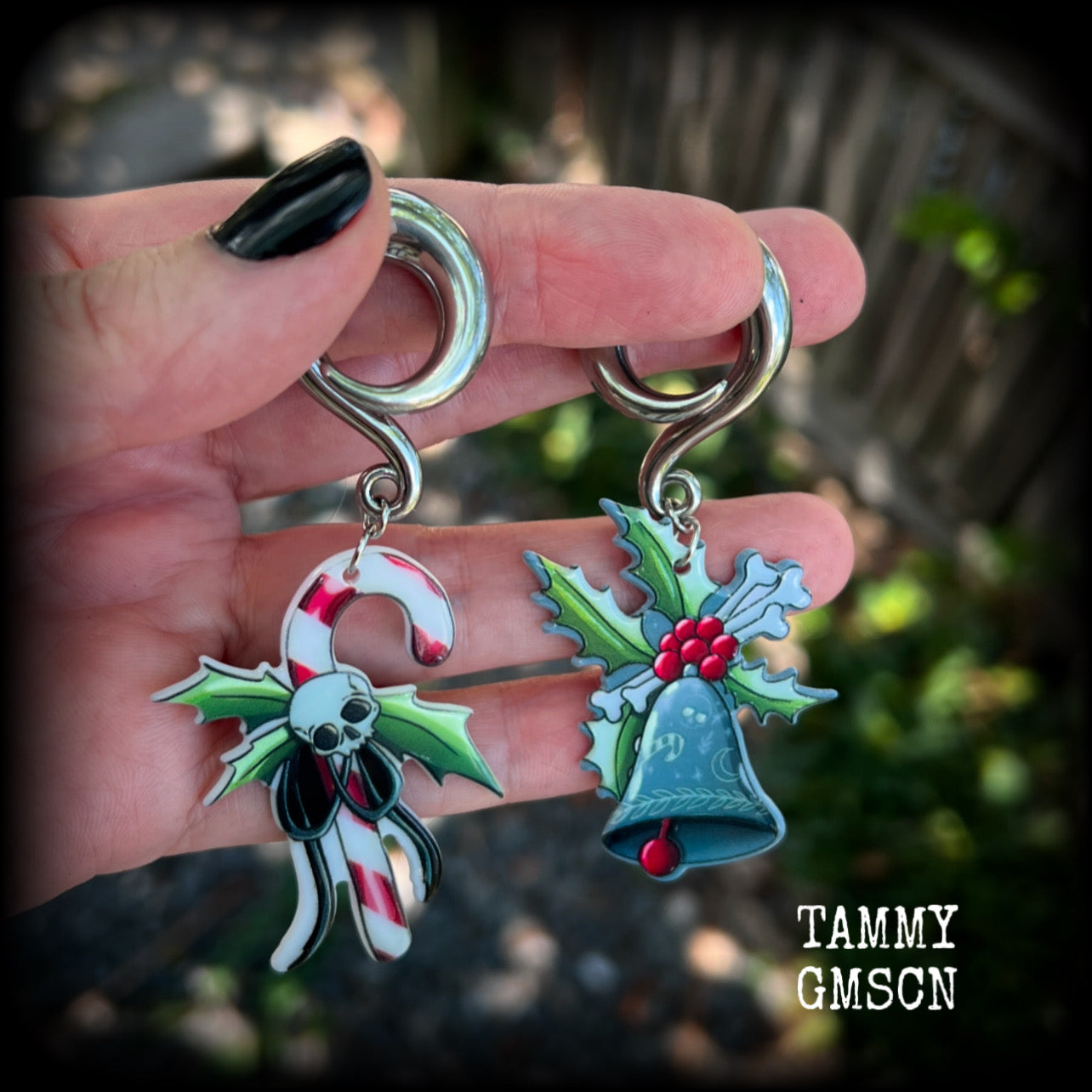 Featuring awesome acrylic candy cane skull and boney Christmas holly and bell charms, these earrings weigh approx 16 grams each, and are lovely and dangly at just under 9cms from tip to tip.

This pair has been made on 0 gauge (8mm) surgical steel full curl hooks, to be worn in stretched lobes.