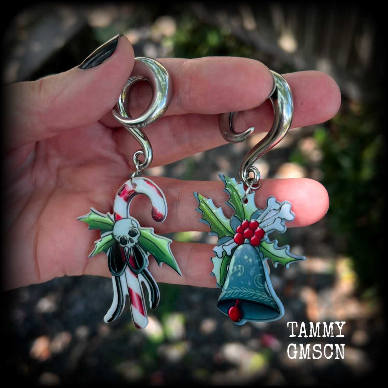 Featuring awesome acrylic candy cane skull and boney Christmas holly and bell charms, these earrings weigh approx 16 grams each, and are lovely and dangly at just under 9cms from tip to tip.

This pair has been made on 0 gauge (8mm) surgical steel full curl hooks, to be worn in stretched lobes.