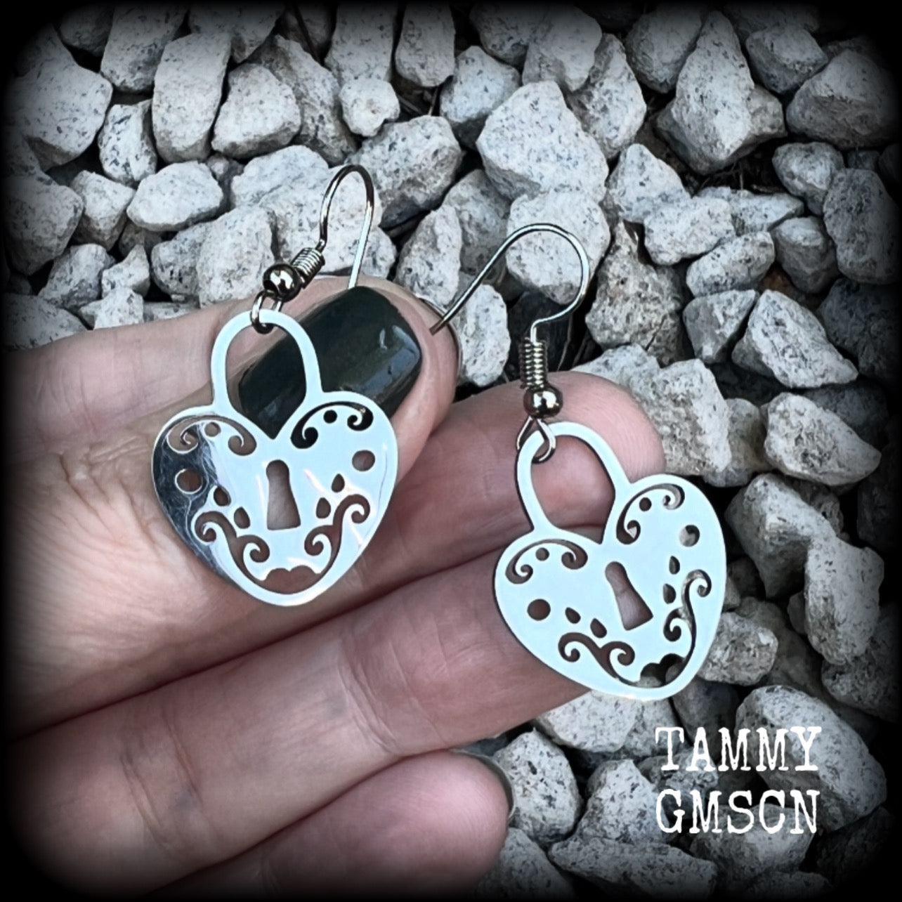 This pair of earrings feature a pretty in punk stainless steel heart padlock, measuring just on 4cms from tip to tip, weighing only a grams or two each.

This pair has been made on stainless steel french hooks, suitable for pierced ears.
