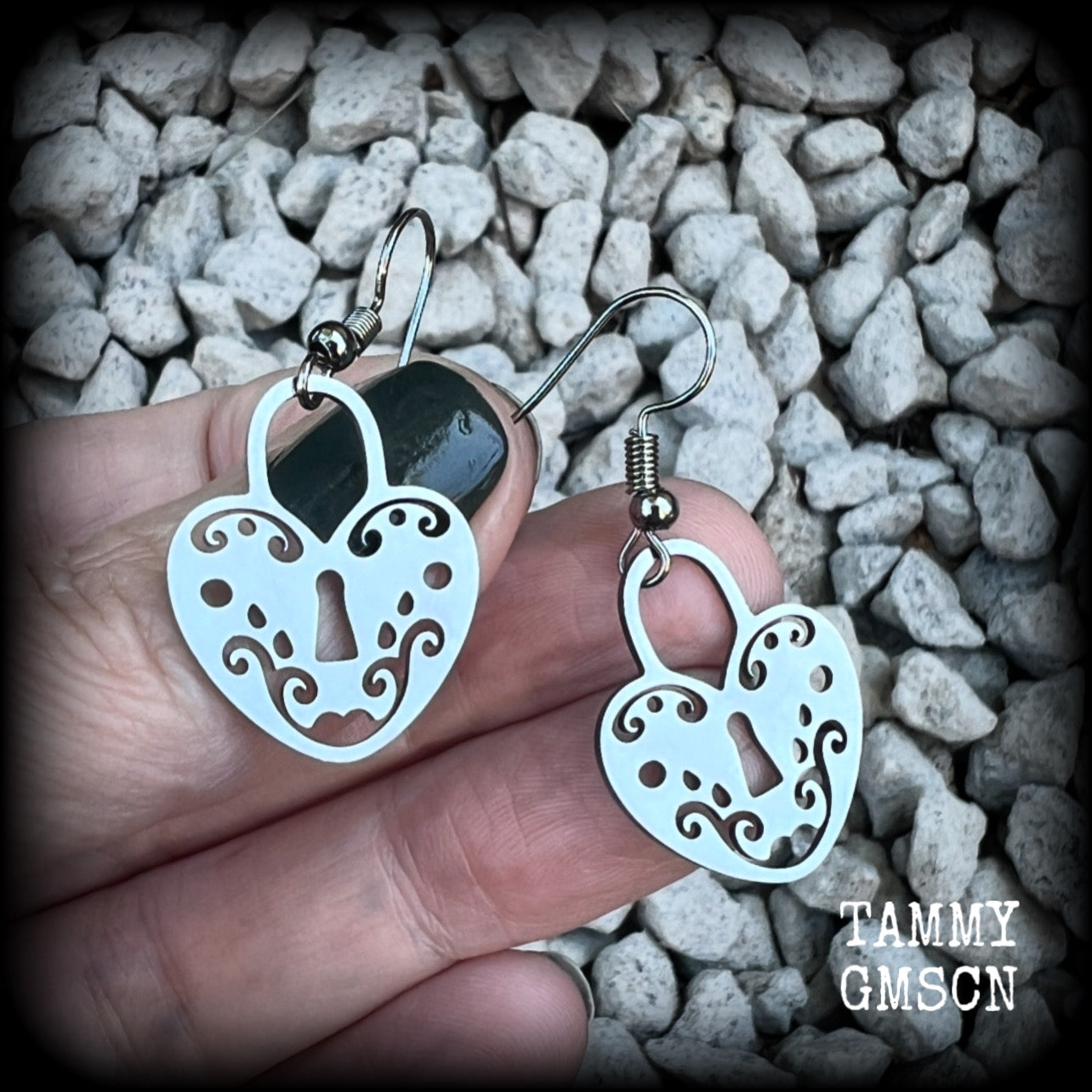 This pair of earrings feature a pretty in punk stainless steel heart padlock, measuring just on 4cms from tip to tip, weighing only a grams or two each.

This pair has been made on stainless steel french hooks, suitable for pierced ears.
