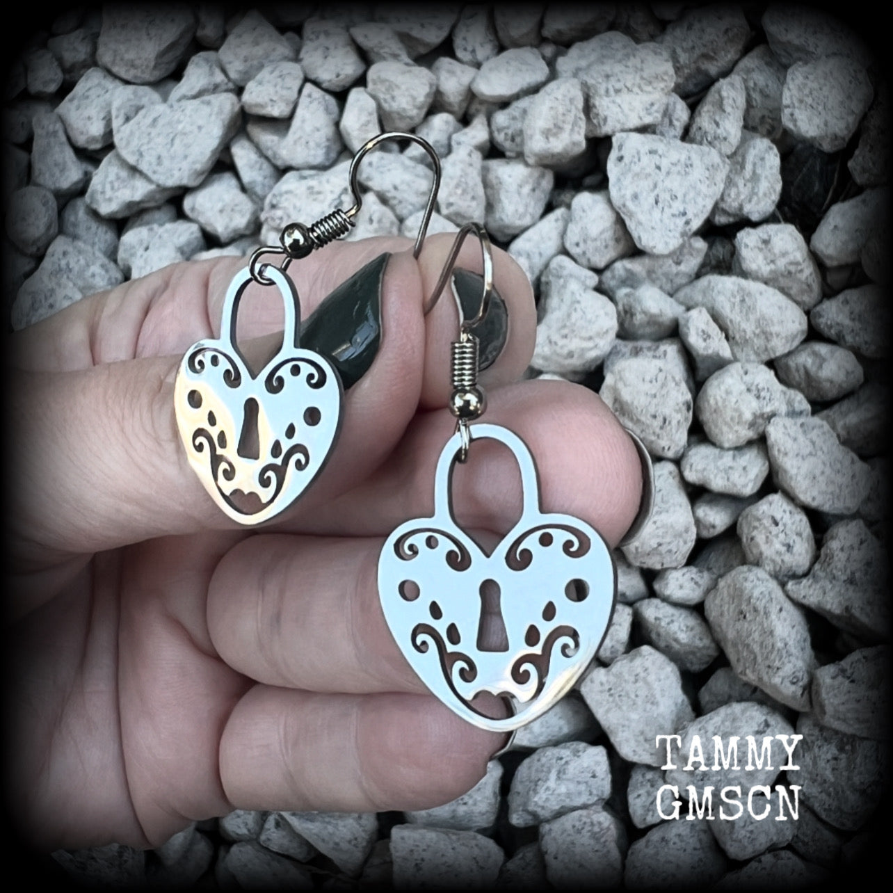 This pair of earrings feature a pretty in punk stainless steel heart padlock, measuring just on 4cms from tip to tip, weighing only a grams or two each.

This pair has been made on stainless steel french hooks, suitable for pierced ears.
