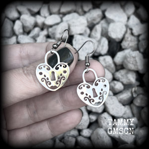 This pair of earrings feature a pretty in punk stainless steel heart padlock, measuring just on 4cms from tip to tip, weighing only a grams or two each.

This pair has been made on stainless steel french hooks, suitable for pierced ears.
