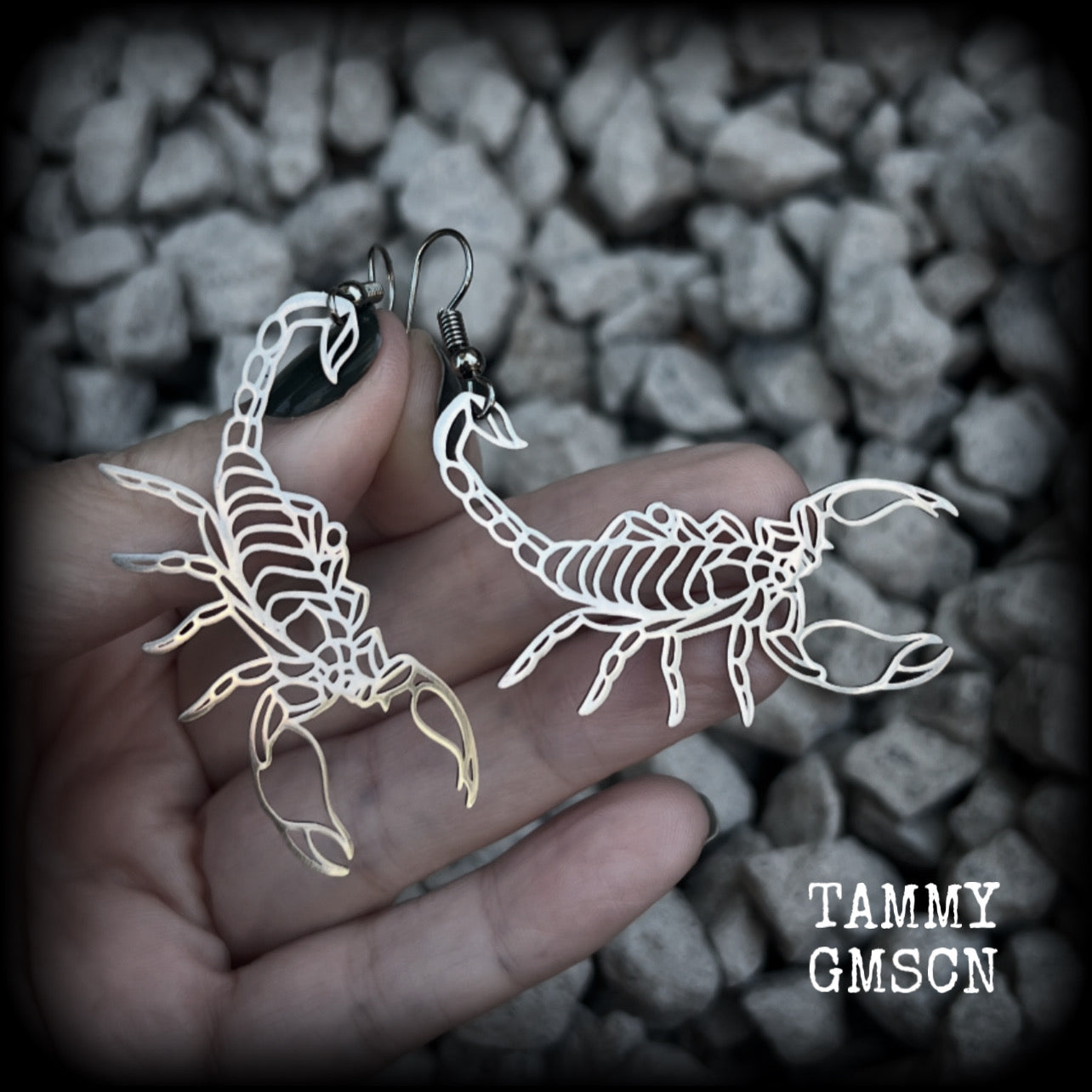 These earrings feature a gorgeous stainless steel desert scorpion, measuring 7cms from tip to tip, and super lightweight at only a few grams each.

This pair have been made with stainless steel french hooks, suitable for pierced ears.
