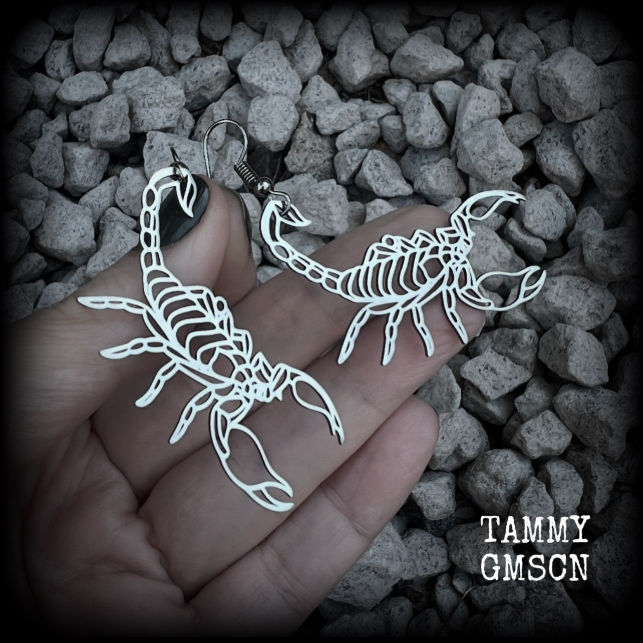 These earrings feature a gorgeous stainless steel desert scorpion, measuring 7cms from tip to tip, and super lightweight at only a few grams each.

This pair have been made with stainless steel french hooks, suitable for pierced ears.
