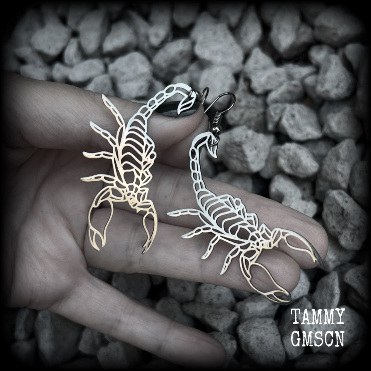 These earrings feature a gorgeous stainless steel desert scorpion, measuring 7cms from tip to tip, and super lightweight at only a few grams each.

This pair have been made with stainless steel french hooks, suitable for pierced ears.
