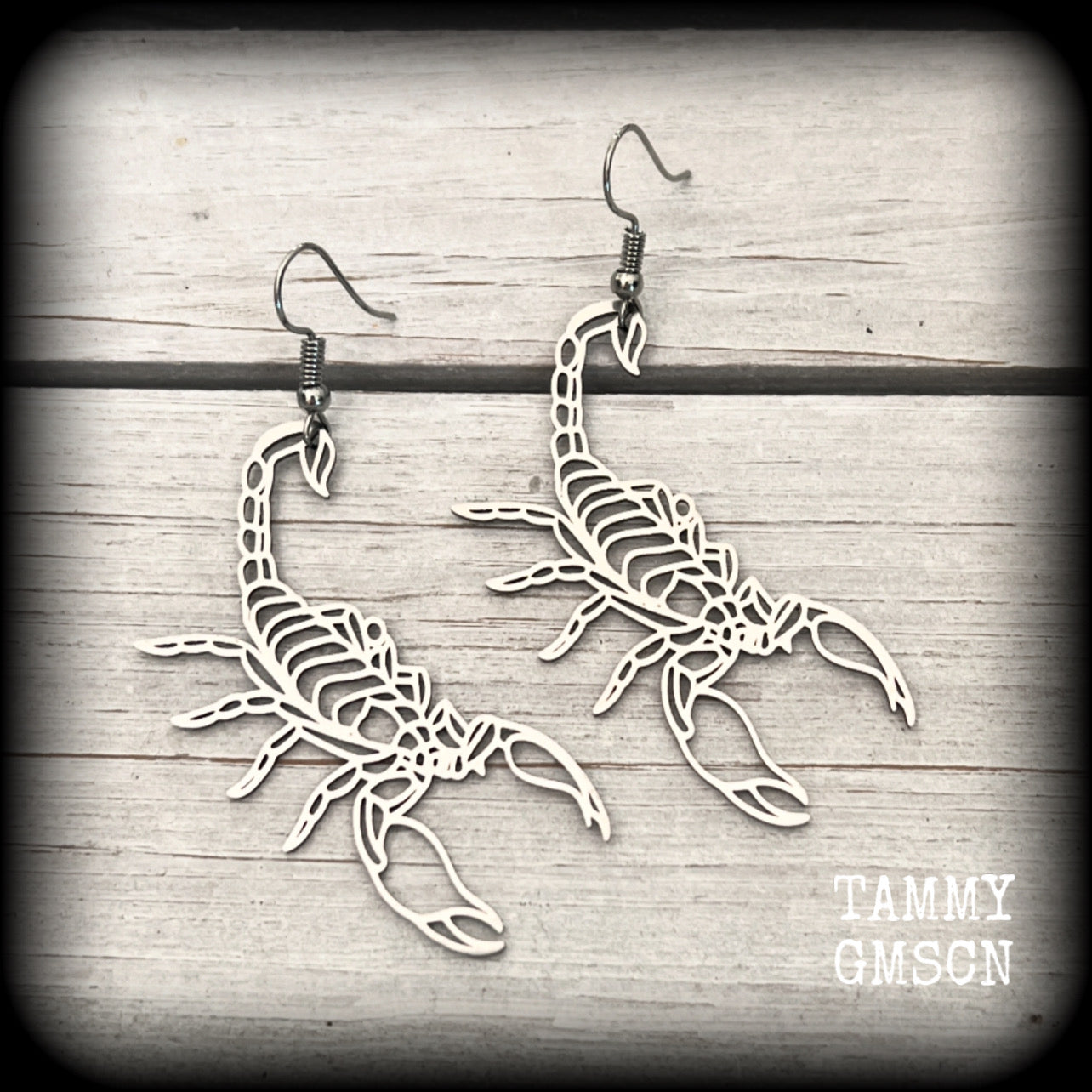 These earrings feature a gorgeous stainless steel desert scorpion, measuring 7cms from tip to tip, and super lightweight at only a few grams each.

This pair have been made with stainless steel french hooks, suitable for pierced ears.
