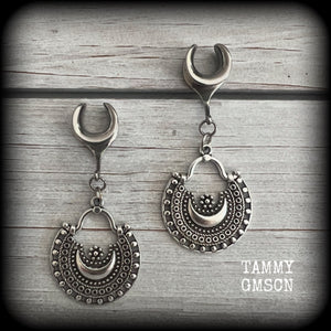 Inspired by Ishtar, Mesopotamian Goddess of love, beauty, sex and war, these beautiful ear hangers feature gorgeous boho antique silver crescent moons.

This is a lightweight pair of earrings at approx 5 grams each, and measuring just over 5.5cms from tip to tip.

This pair has been made on 00 gauge (10mm) surgical steel cradles, to be worn in stretched lobes.