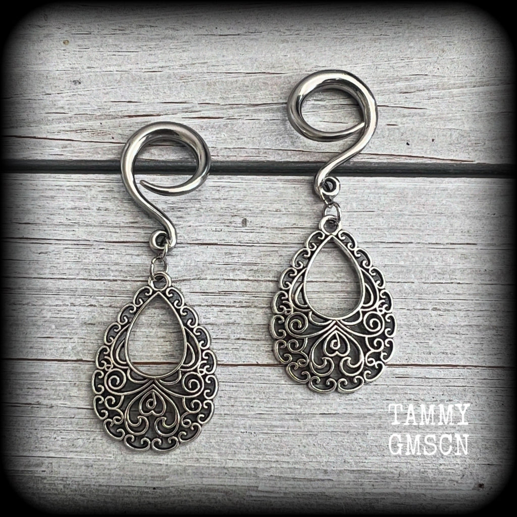 These beautiful ornate ear hangers feature antique silver filigree teardrop mandalas, inspired by Aphrodite, the Greek Goddess of love and beauty.
These earrings nice and light weight, weighing approx 6 grams a piece and measure just on 6.5cms from tip to tip.

This pair has been made on 6 gauge (4mm) surgical steel full curl hooks, suitable for stretched lobes.