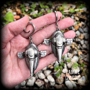 Featuring big beautiful Boba Fett Slave One spaceships, these gauged earrings weigh approx 40 grams each and measure just under 9cms from tip to tip, a must have for any Star Wars fan!

This pair has been made on 6 gauge (4mm) surgical steel full curls, to be worn in stretched lobes.