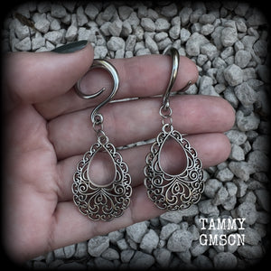 These beautiful ornate ear hangers feature antique silver filigree teardrop mandalas, inspired by Aphrodite, the Greek Goddess of love and beauty. These earrings nice and light weight, weighing approx 6 grams a piece and measure just on 6.5cms from tip to tip.  This pair has been made on 6 gauge (4mm) surgical steel full curl hooks, suitable for stretched lobes.