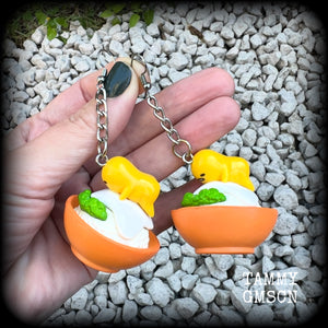 These earrings are TOO CUTE!!! Featuring the adorable Gudetama lazy egg man himself laying on a bowl of rice with a dash of wasabi, these earrings measure just on 8cms and weighing approx 20 grams.

This pair has been made on stainless steel french hooks, suitable for pierced ears.