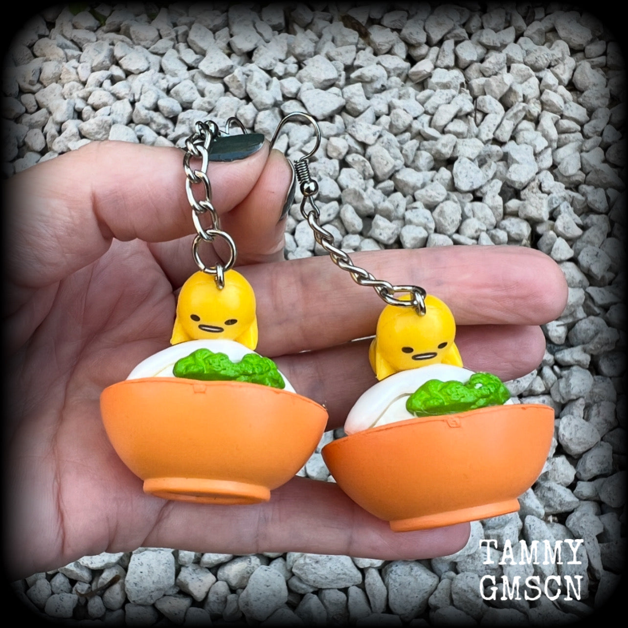 These earrings are TOO CUTE!!! Featuring the adorable Gudetama lazy egg man himself laying on a bowl of rice with a dash of wasabi, these earrings measure just on 8cms and weighing approx 20 grams.

This pair has been made on stainless steel french hooks, suitable for pierced ears.