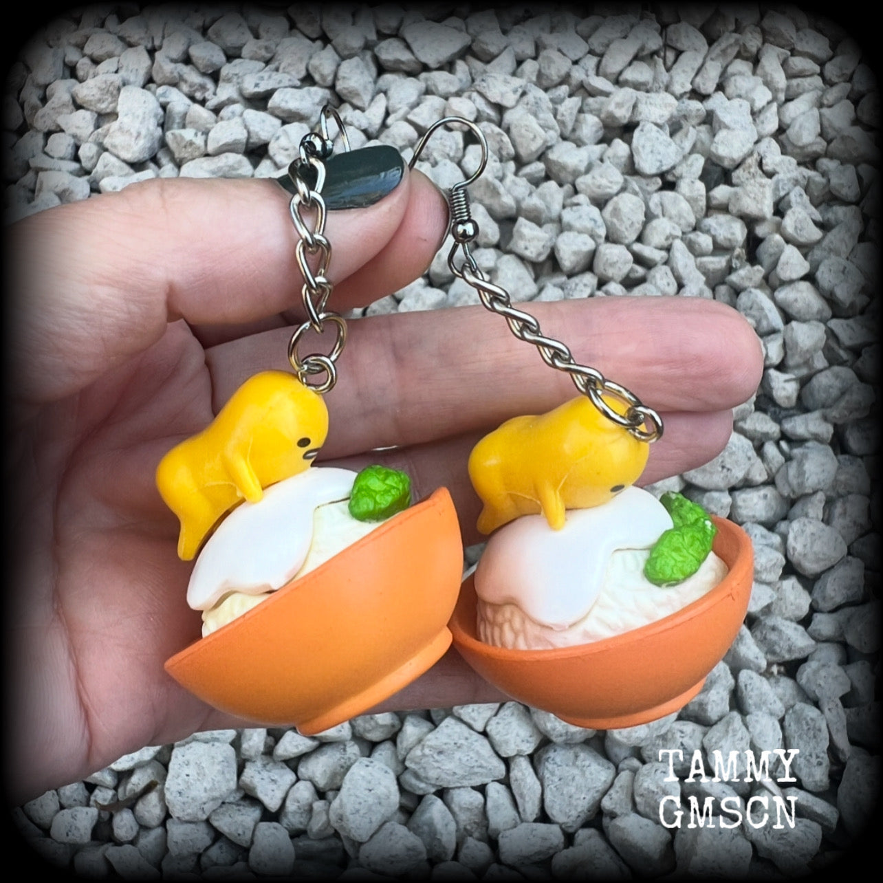 These earrings are TOO CUTE!!! Featuring the adorable Gudetama lazy egg man himself laying on a bowl of rice with a dash of wasabi, these earrings measure just on 8cms and weighing approx 20 grams.

This pair has been made on stainless steel french hooks, suitable for pierced ears.