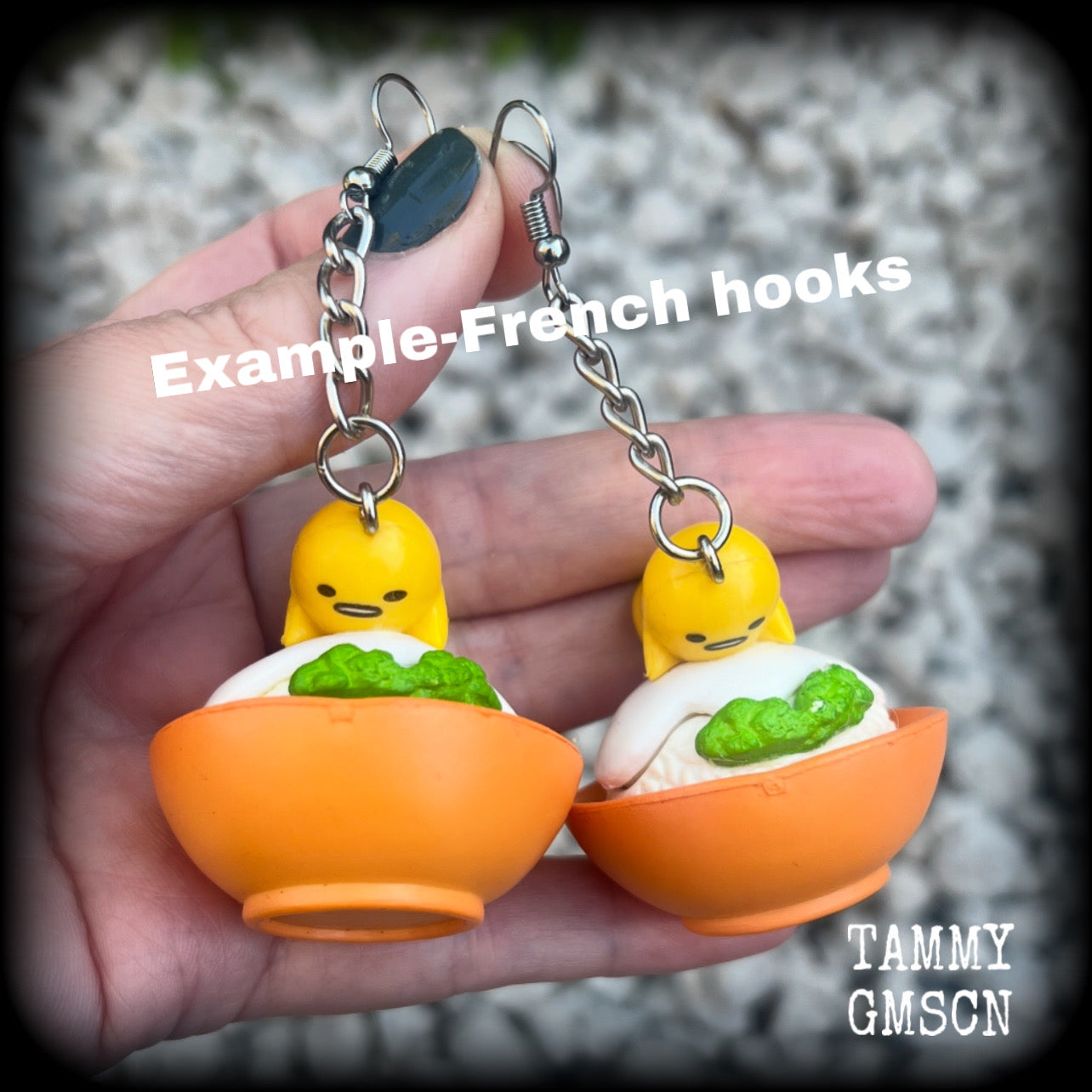 These earrings are TOO CUTE!!! Featuring the adorable Gudetama lazy egg man himself laying on a bowl of rice with a dash of wasabi, these earrings measure just on 8cms and weighing approx 20 grams.

This pair has been made on stainless steel french hooks, suitable for pierced ears.