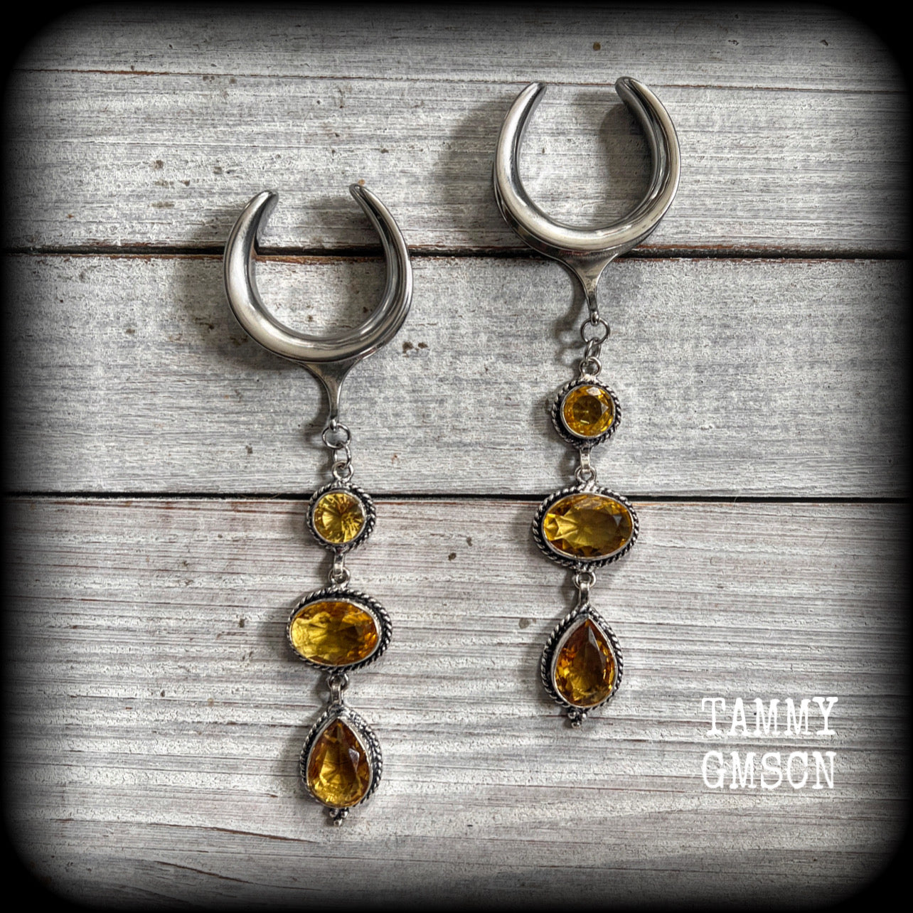 These earrings have been made with beautiful dangly yellow citrine gemstones in a gorgeous boho antique silver setting, lovely and dangly at just on 10.5cms from tip to tip, and weighing approx 15 grams each.

These earrings have been made on 1” gauge (25mm) surgical steel cradles, to be worn in stretched lobes.