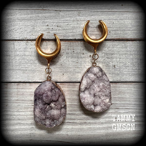 This is a pair of gorgeous dusty purple druzy ear hangers featuring real druzy gems in an antique gold setting.

Measuring just 7.5 cms from tip to tip, and weighing approx 25 & 35 grams each, these gorgeous rustic earrings are big, beautiful, unique and absolutely fabulous!!

This pair has been made on 3/4” gauge (19mm) titanium coated surgical steel cradles, for stretched lobes.