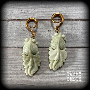 These gorgeous earrings feature carved jade koi fish, weighing approx. 20 grams each and measuring approx 9cms from tip to tip.

This pair have been made on 6 gauge (4mm) surgical steel full curls, suitable for stretched lobes.