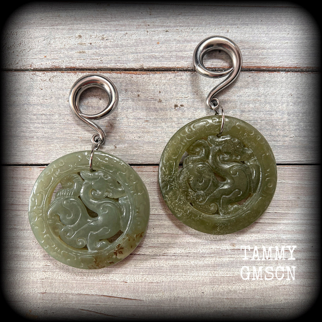 These gorgeous dusty green gemstone earrings feature hand carved Lantian jade pendants featuring the beautiful mythological dragons.
This pair weighs approx 35 grams a piece and measure just over 8cms from tip to tip, made on 2 gauge (6mm) surgical steel full curl hooks, suitable for stretched lobes.