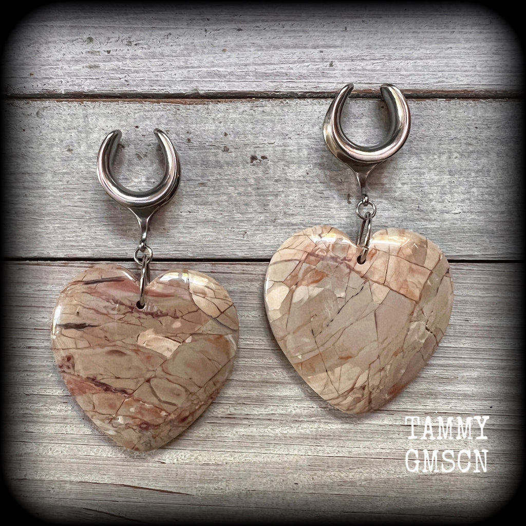 This is a pair of one-of-a-kind beautiful big Picture jasper heart gauged earrings, measuring just under 8cms from tip to tip, and weighing approx 25 grams each.
These earrings have been made on 3/4” gauge (19mm) surgical steel cradles.