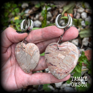 This is a pair of one-of-a-kind beautiful big Picture jasper heart gauged earrings, measuring just under 8cms from tip to tip, and weighing approx 25 grams each.
These earrings have been made on 3/4” gauge (19mm) surgical steel cradles.