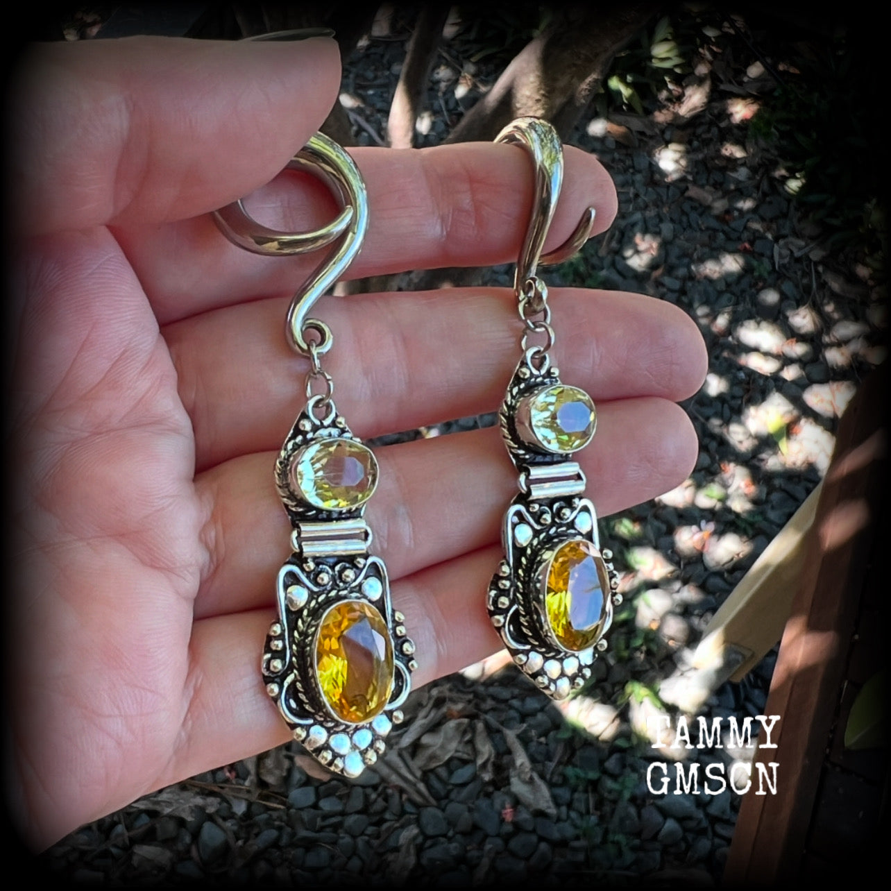 🔥 Citrine attracts good luck, clarity and confidence 🔥

Featuring gorgeous golden yellow cutrine gemstone in a beautiful boho antique silver setting, these earrings measure just on 8cms from tip to tip, and weigh approx 14 grams each.

This pair have been made on 6 gauge (4mm) surgical steel full curl hooks, suitable for stretched lobes.