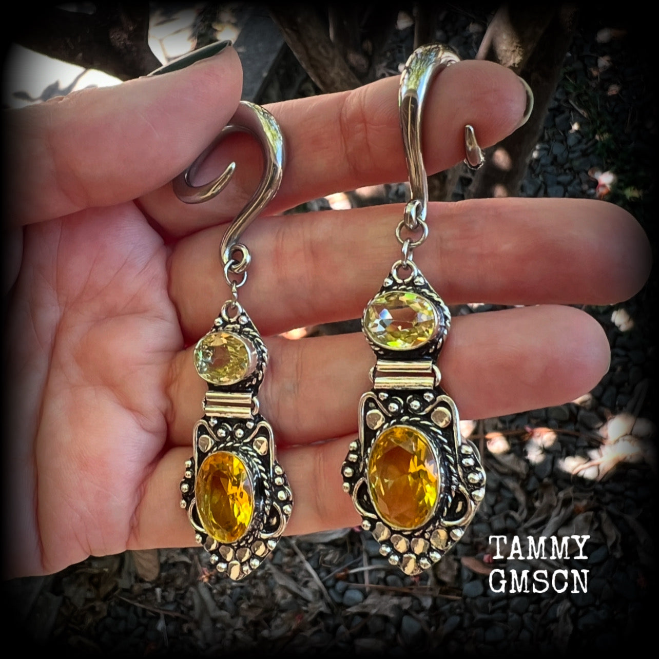 🔥 Citrine attracts good luck, clarity and confidence 🔥

Featuring gorgeous golden yellow cutrine gemstone in a beautiful boho antique silver setting, these earrings measure just on 8cms from tip to tip, and weigh approx 14 grams each.

This pair have been made on 6 gauge (4mm) surgical steel full curl hooks, suitable for stretched lobes.