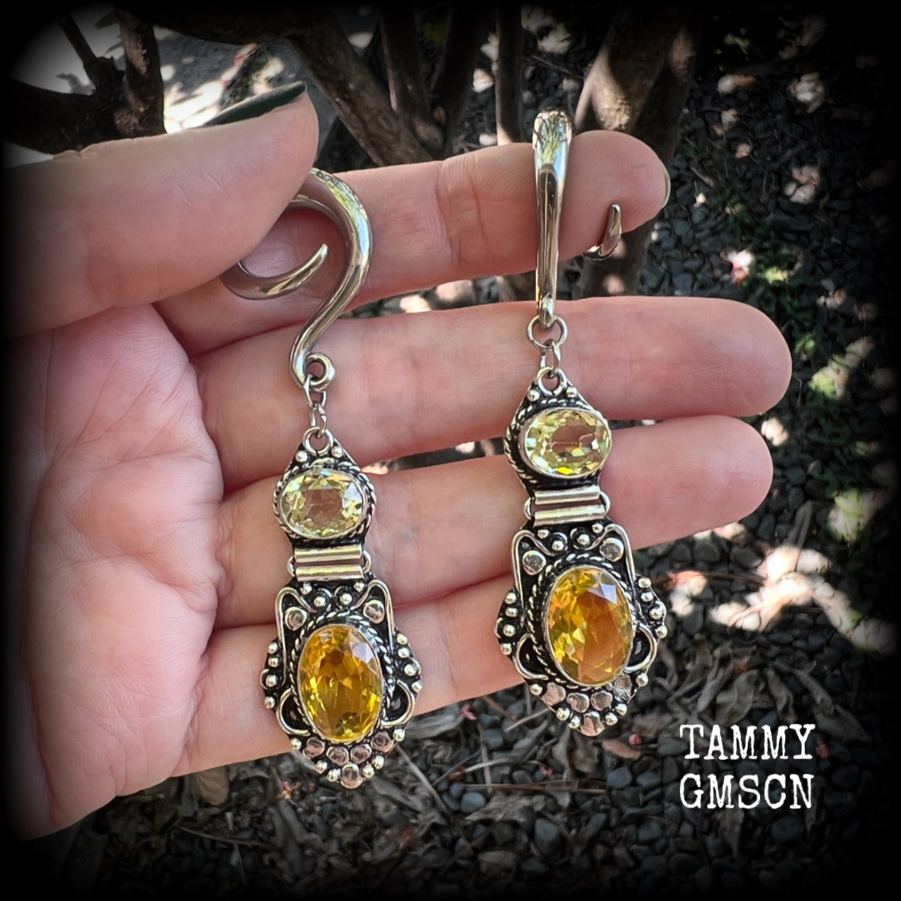 🔥 Citrine attracts good luck, clarity and confidence 🔥

Featuring gorgeous golden yellow cutrine gemstone in a beautiful boho antique silver setting, these earrings measure just on 8cms from tip to tip, and weigh approx 14 grams each.

This pair have been made on 6 gauge (4mm) surgical steel full curl hooks, suitable for stretched lobes.
