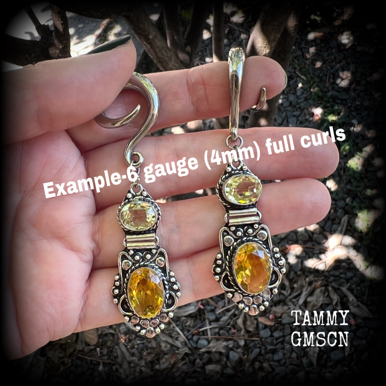 🔥 Citrine attracts good luck, clarity and confidence 🔥

Featuring gorgeous golden yellow cutrine gemstone in a beautiful boho antique silver setting, these earrings measure just on 8cms from tip to tip, and weigh approx 14 grams each.

This pair have been made on 6 gauge (4mm) surgical steel full curl hooks, suitable for stretched lobes.