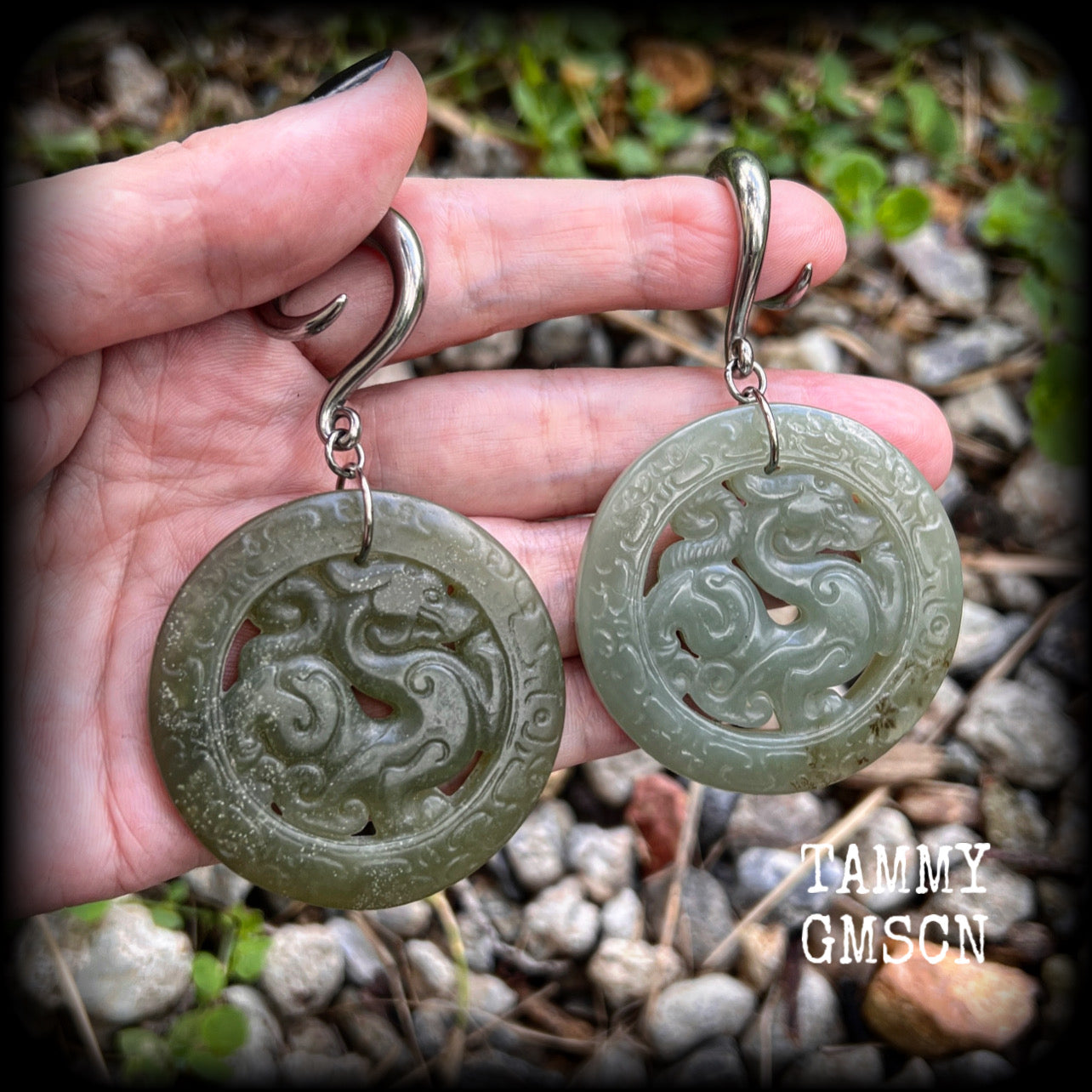 These earrings have Lantian jade pendants featuring the beautiful mythological dragons.
This pair weighs approx 35 grams a piece and measure just over 8cms from tip to tip, made on 2 gauge (6mm) surgical steel full curl hooks, for stretched lobes.