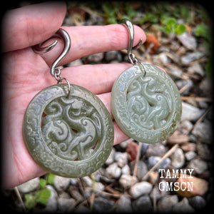These earrings have Lantian jade pendants featuring the beautiful mythological dragons.
This pair weighs approx 35 grams a piece and measure just over 8cms from tip to tip, made on 2 gauge (6mm) surgical steel full curl hooks, for stretched lobes.