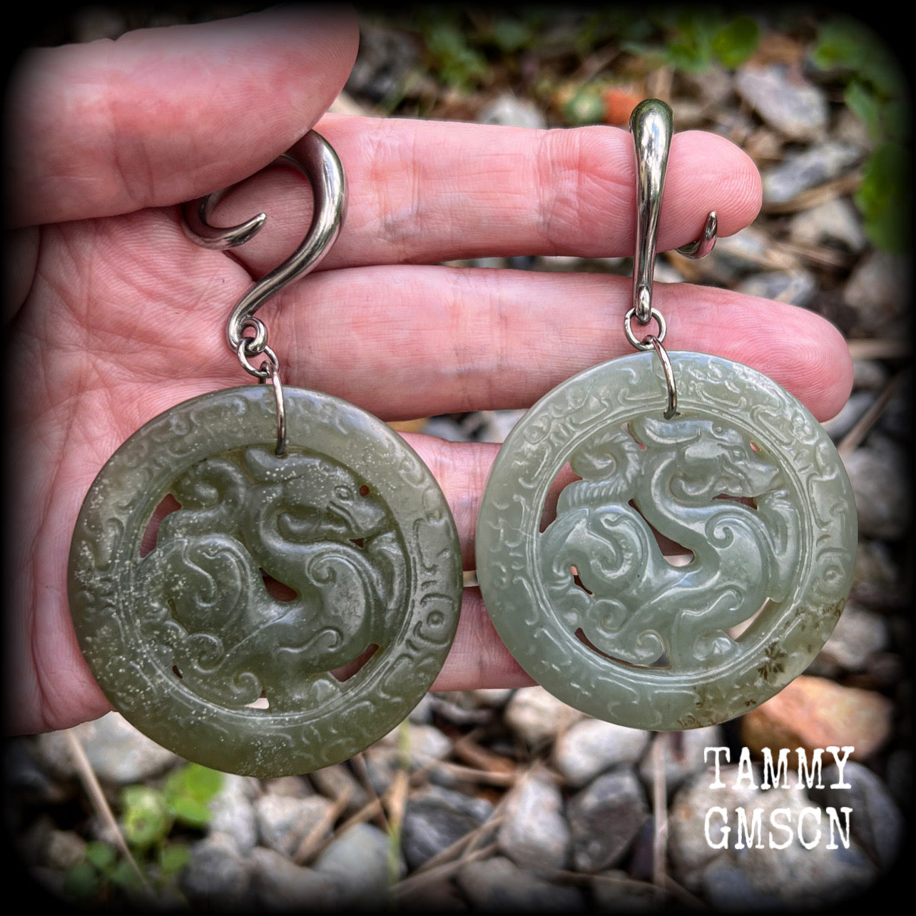 These earrings have Lantian jade pendants featuring the beautiful mythological dragons.
This pair weighs approx 35 grams a piece and measure just over 8cms from tip to tip, made on 2 gauge (6mm) surgical steel full curl hooks, for stretched lobes.