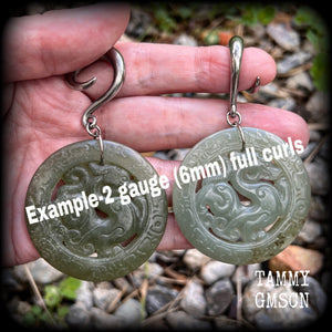These earrings have Lantian jade pendants featuring the beautiful mythological dragons.
This pair weighs approx 35 grams a piece and measure just over 8cms from tip to tip, made on 2 gauge (6mm) surgical steel full curl hooks, for stretched lobes.