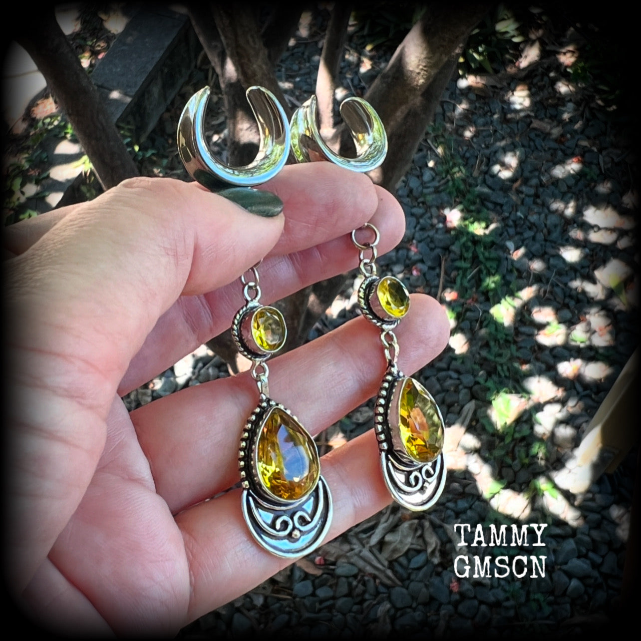 Featuring gorgeous golden yellow cutrine gemstone in a beautiful boho antique silver setting, these earrings measure just over 8cms from tip to tip, and weigh approx 11 grams each.

This pair have been made on 5/8” gauge (16mm) surgical steel full curl hooks, suitable for stretched lobes.

